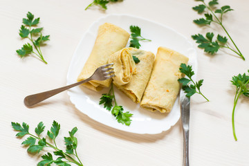 thin fried pancakes stuffed with stewed cabbage