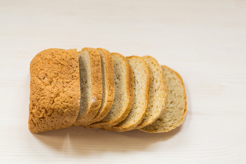 fresh homemade bread sliced on wooden background