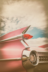 Rear end of a pink classic car