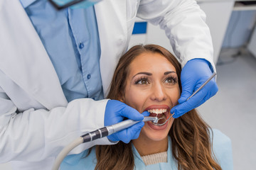 Fototapeta premium Dentist working on patients teeth
