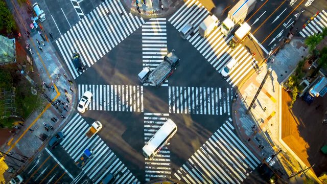 Time lapse Video Top View of Ginza crossing at the time of termination. Many people and cars are passing through The light from the sun gradually moves on the road, Travel and Transportation concept