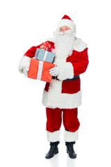 santa claus with white beard holding christmas presents isolated on white