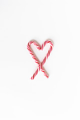 Heart Shape Candy Canes On White Background