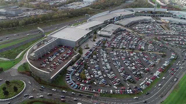 Aerial footage of traffic and car parks at the Glasgow Fort shopping and leisure park, and traffic on the adjacent M8 motorway..