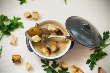 soup puree with mushrooms and croutons in an bowl