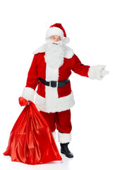 santa claus with red christmas bag showing something isolated on white