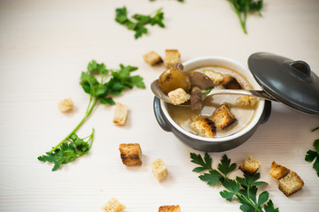 soup puree with mushrooms and croutons in an bowl