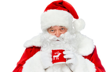 smiling santa claus with white beard holding coffee cup isolated on white