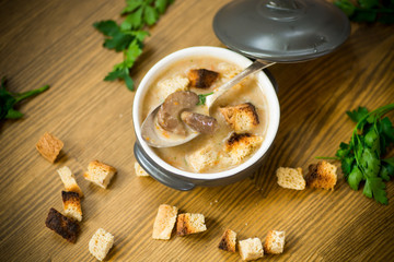 soup puree with mushrooms and croutons in an bowl