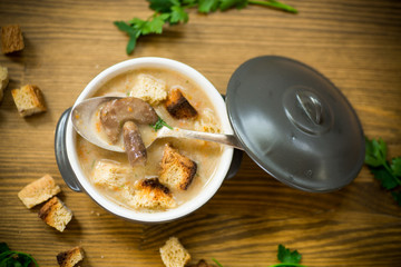 soup puree with mushrooms and croutons in an bowl