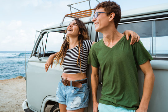 Hipster couple relaxing on her summer road trip