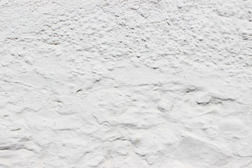 White uneven historical building outer wall detail texture fragment background specks streaks dots