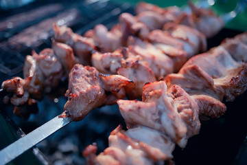 pork ribs on the grill cooking coals / fresh meat pork cooked on charcoal, summer home cooked meal, grilled ribs