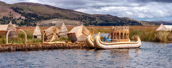 Foto op Canvas Traditional village on floating islands on lake Titicaca in Peru © Belikova Oksana