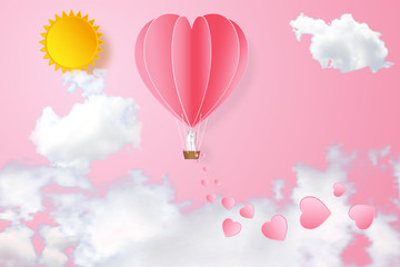 Obraz na płótnie Canvas Paper art , cut and digital craft style of the lover in hot air heart balloon on pink sky and sunny as love, happy valentine's day and wedding concept. vector illustration.