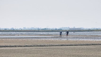 Fototapeta na wymiar Salt farm (evaporation ponds) of Phetchaburi Province, Thailand