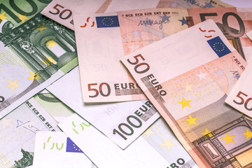Euro paper money: closeup of banknotes, fifty, hundred, finances, investment, business, background, texture.