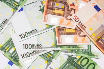 Euro paper money: closeup of banknotes, fifty, hundred, finances, investment, business, background, texture. Finance background. Business, financial success and making money concept.