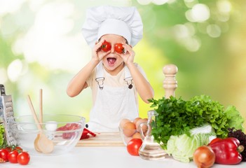Portrait of adorable little girl preparing healthy food at