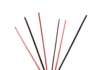 A stick of fragrant, Asian incense isolated on a white background with a clipping path.