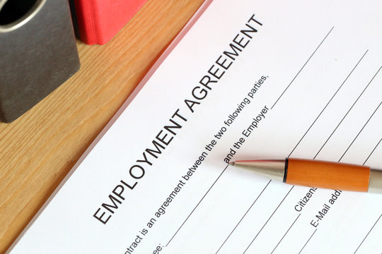 Blank form of an employment agreement on a desk