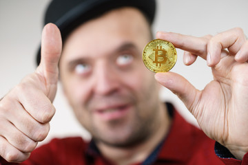 Man having bitcoin coin