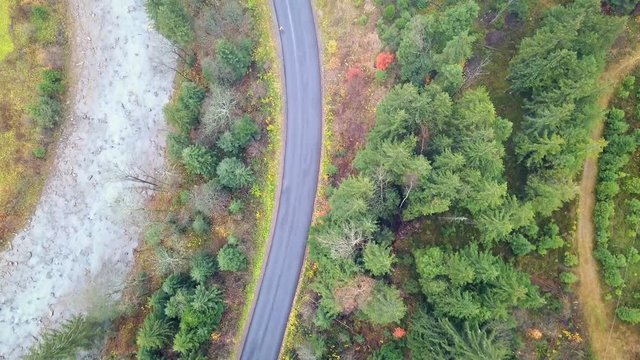 Bird's-eye view of the mountain road that runs along the Prut River. Carpathians. Ukraine. Top view