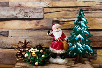 Santa Claus figurine christmas decoration over wooden background