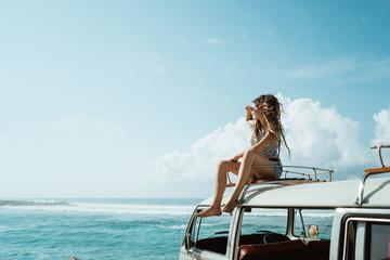 beauty woman looking around and enjoy blow wind on the roof 