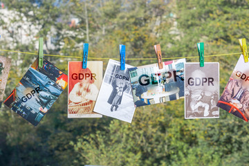GDPR inscription on a photo suspended on a rope with the help of earpieces