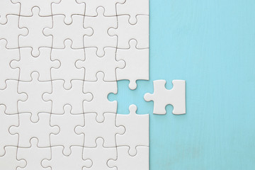 background of white puzzle with missing piece.