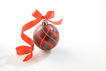 Christmas bauble with red bow on white