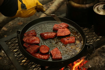 cooking meat on the grill