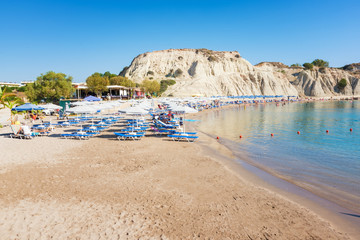 Kolymbia beach with umbrellas and sunbeds (Rhodes, Greece)