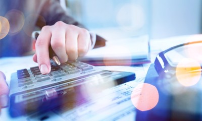 Man's hand typing on keyboard