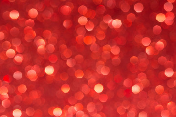 Sparkle glittering background. Glitter vintage lights background. Red. De-focused. Abstract bokeh lights.