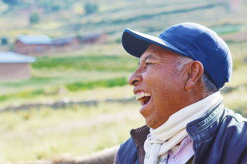 Native american man laughing in the countryside.