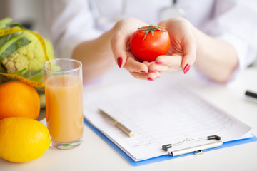 Conceptual Photo Of A Female Nutritionist With Fruits On The Desk