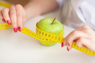 Diet. Fitness and healthy food diet concept. Balanced diet with vegetables. Cheerful doctor...