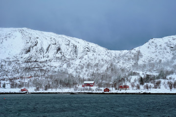 Rd rorbu houses in Norway in winter