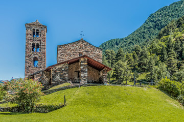 Hilltop and stone church facade in the Pyrenees. Andorra Europe - obrazy, fototapety, plakaty