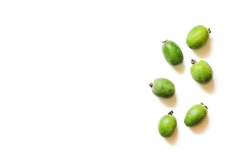 Green feijoa fruits on white background