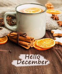 Obraz na płótnie Canvas Winter theme. Cup of hot tea with spices, orange, cinnamon, anis