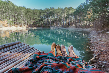 Couple relaxing by the lake
