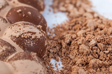 Broken milky porous chocolate, sweets and desserts