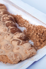 Broken milky porous chocolate, sweets and desserts