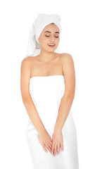Portrait of young pretty woman with towels on white background