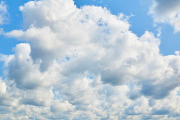 Porous clouds in the blue sky. Nature background.