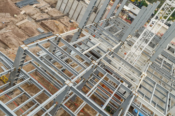 Top view of steel girders. General view of a tall construction beams