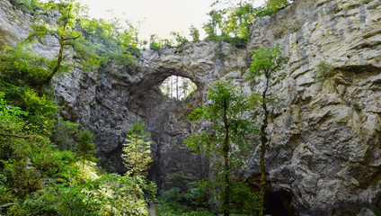 Fototapeta na wymiar Rakov Skocjan ( Rakov Škocjan ) is a karst valley and the oldest landscape park in Slovenia. Small Natural Bridge ( Mali Naravni Most ) is most important geologic phenomena of the park. 